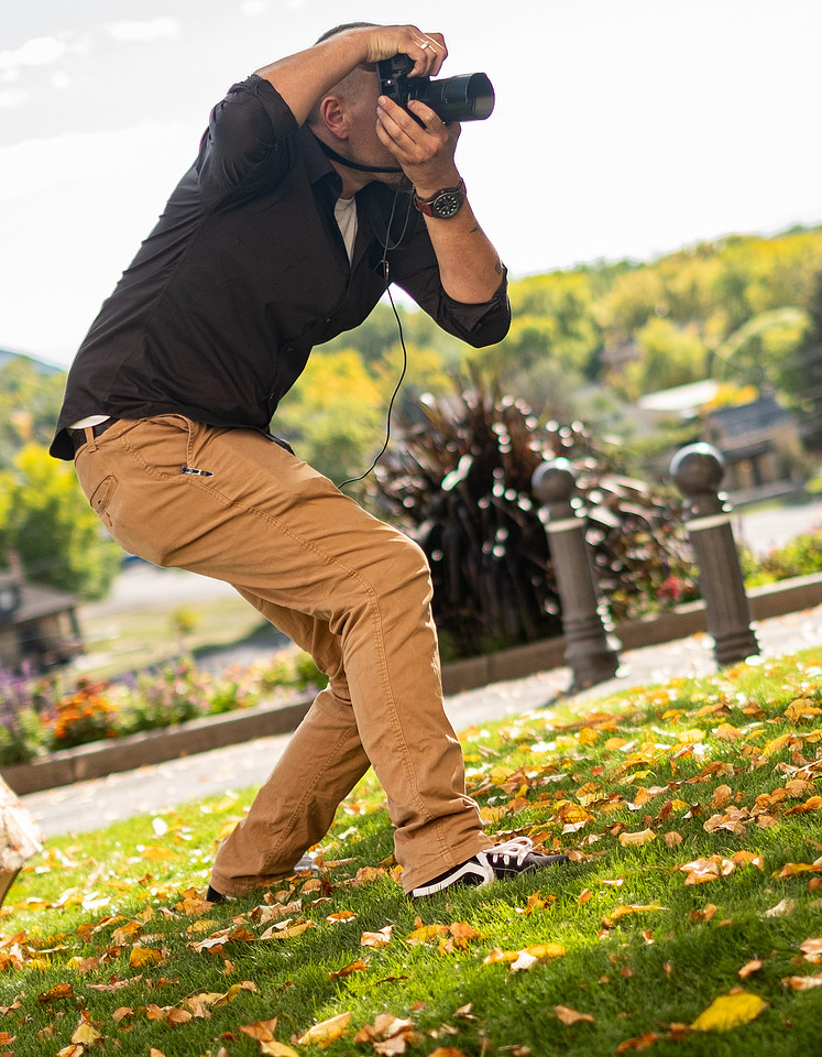 Robert Stevens photographing an outdoor event in Utah